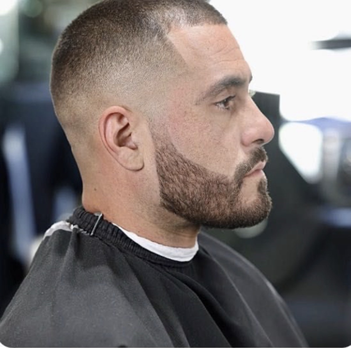 Bald fade with a crisp beard shape-up