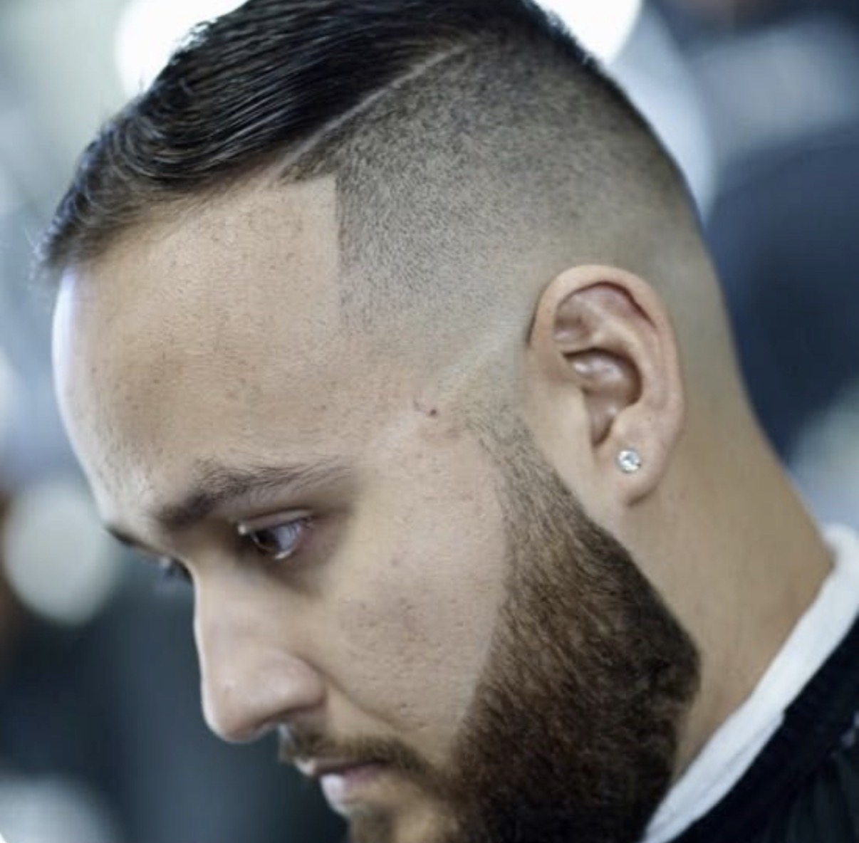 Side-part fade with a detailed beard