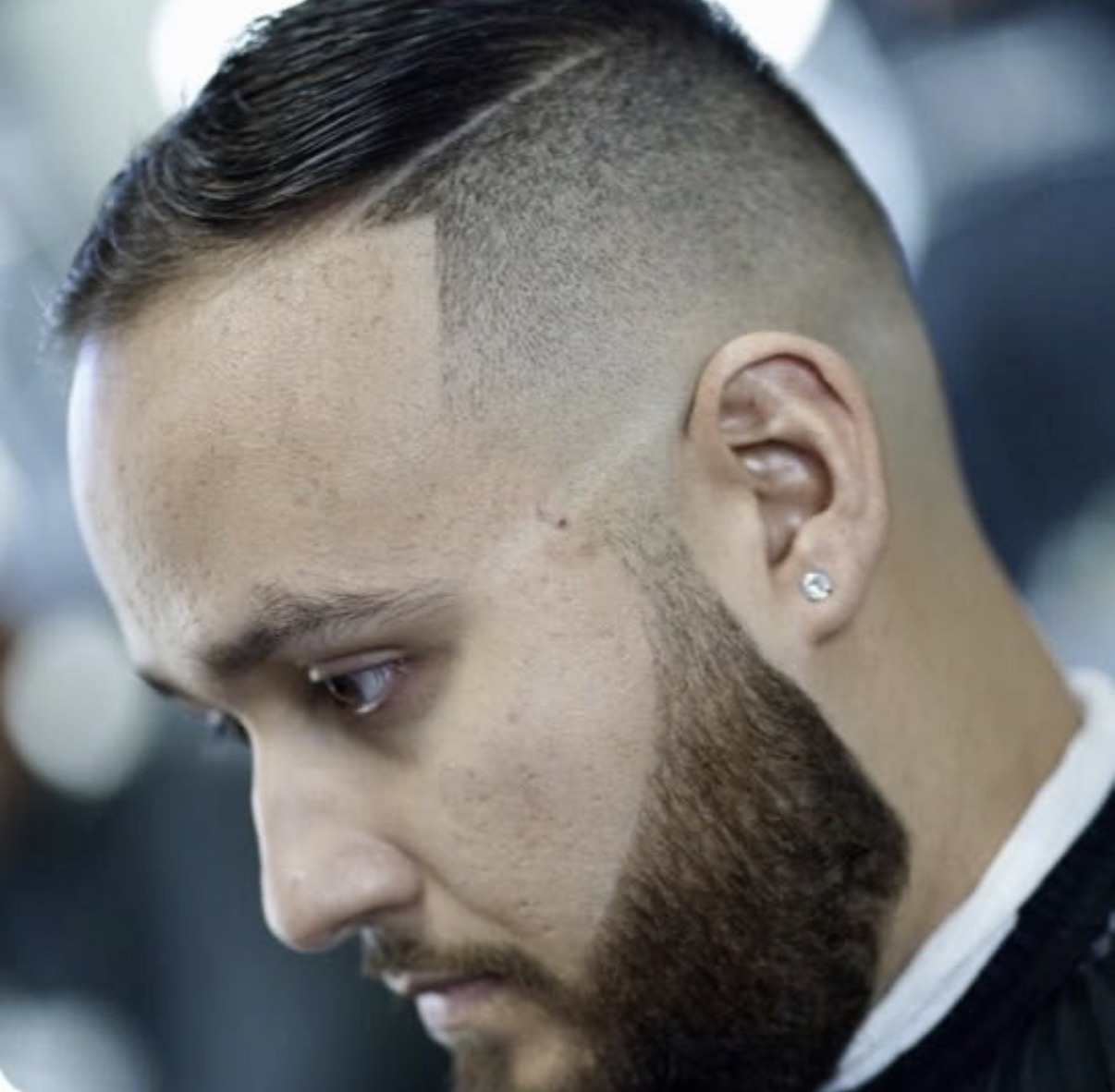 Comb-over fade with a razor part