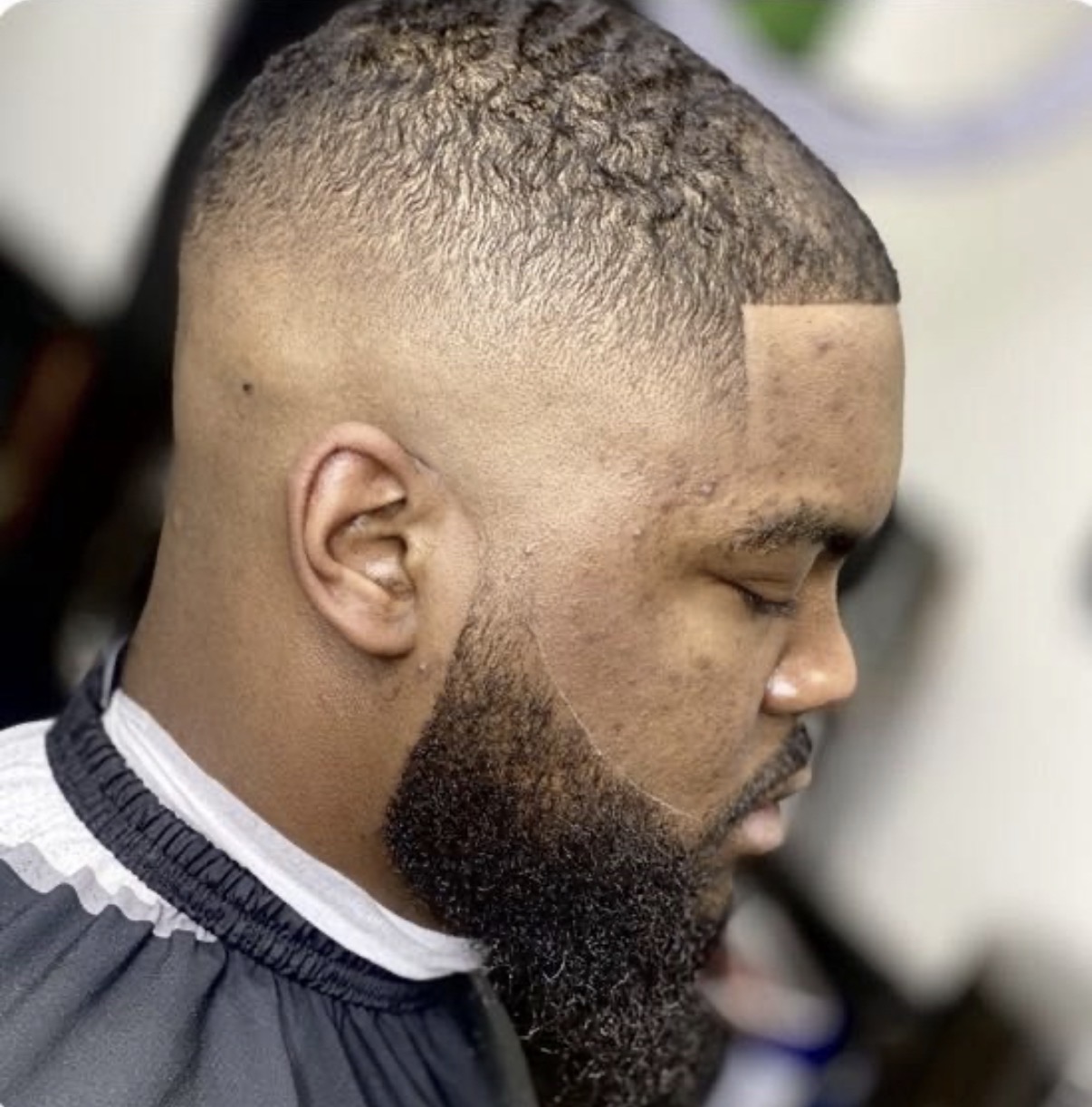 Skin fade with a defined hairline
